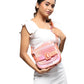 buy-caprese-caprese-theia-iridescent-pink-faux-leather-small-sling-bag_xm9