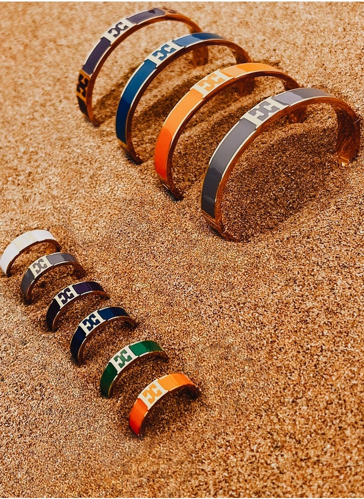 buy-escada-scarlett-gold-plated-ring-with-logo-cutout-and-orange-enamel-detail_h63