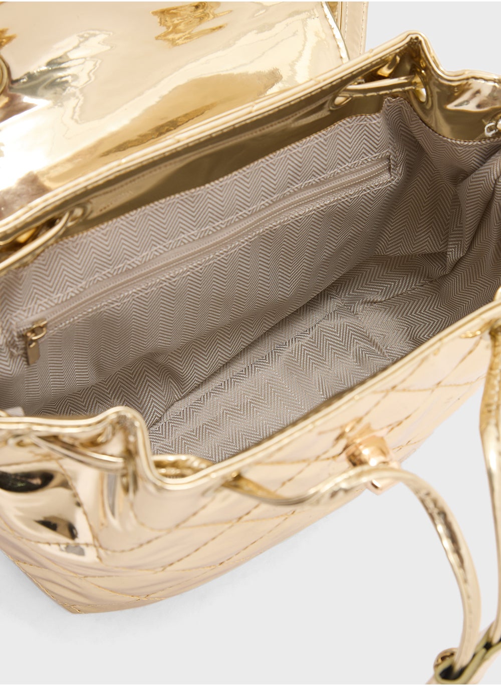 buy-ginger-quilted-metallic-mini-backpack_nid