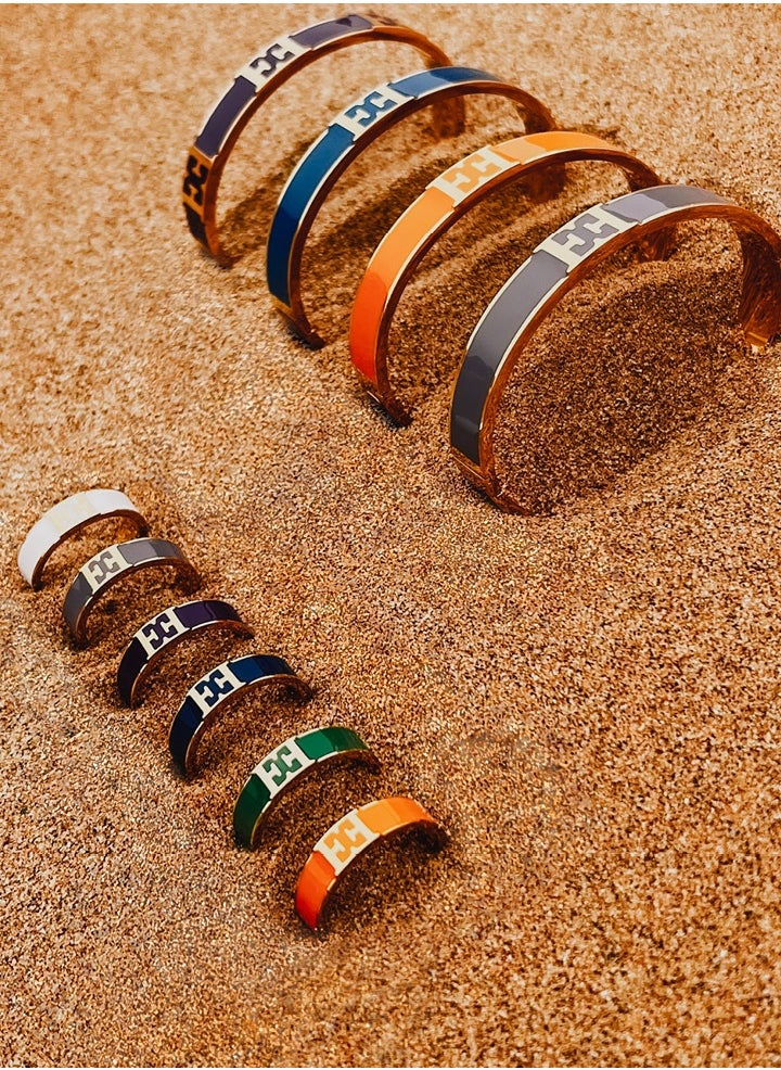 buy-escada-scarlett-gold-plated-ring-with-logo-cutout-and-purple-enamel-detail_5jj