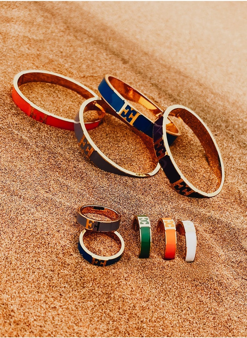 buy-escada-carlett-gold-plated-bangle-with-logo-cutout-and-green-enamel-detail_fb3