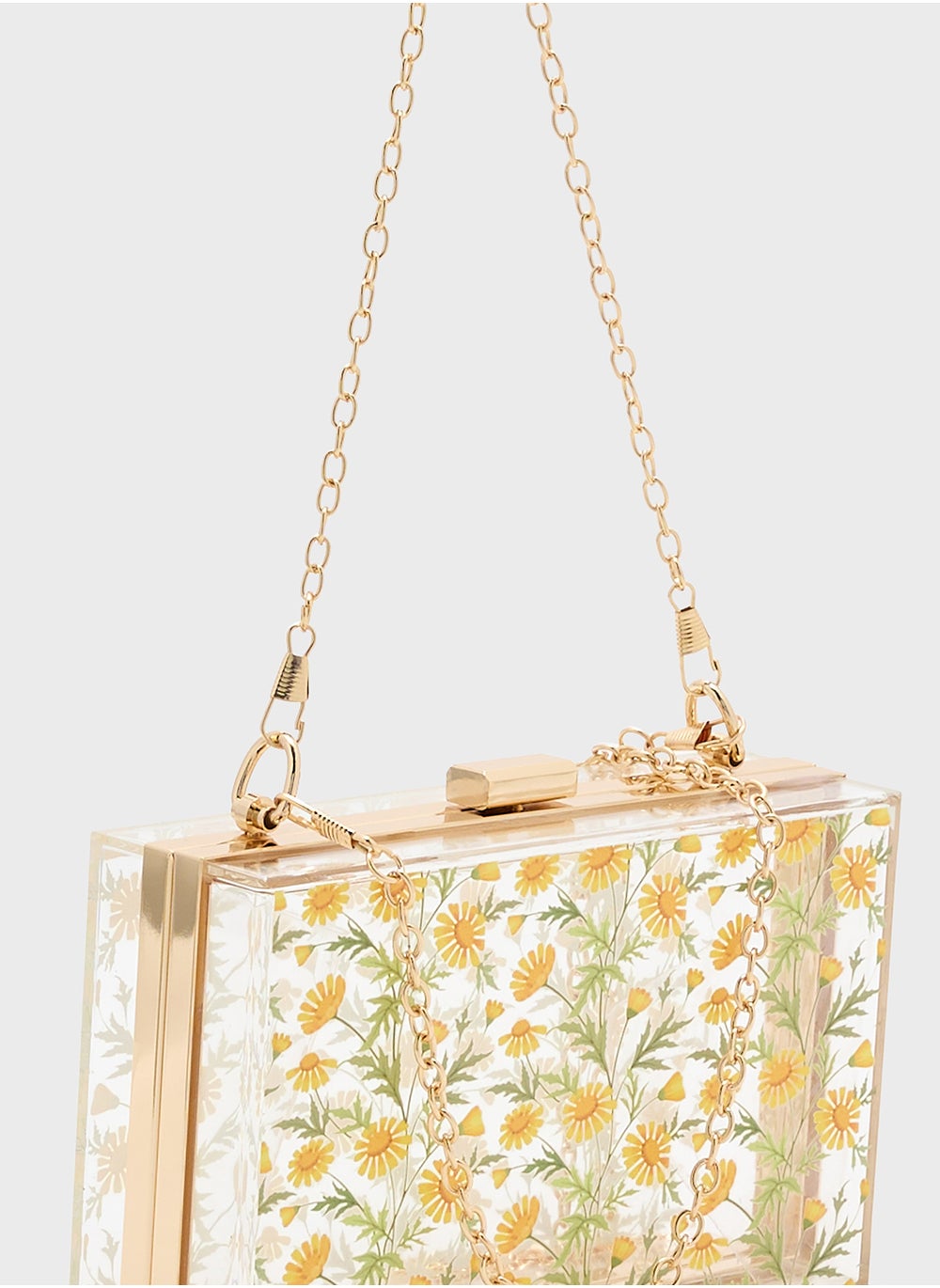 buy-ella-daisy-print-clear-clutch-bag_eyo