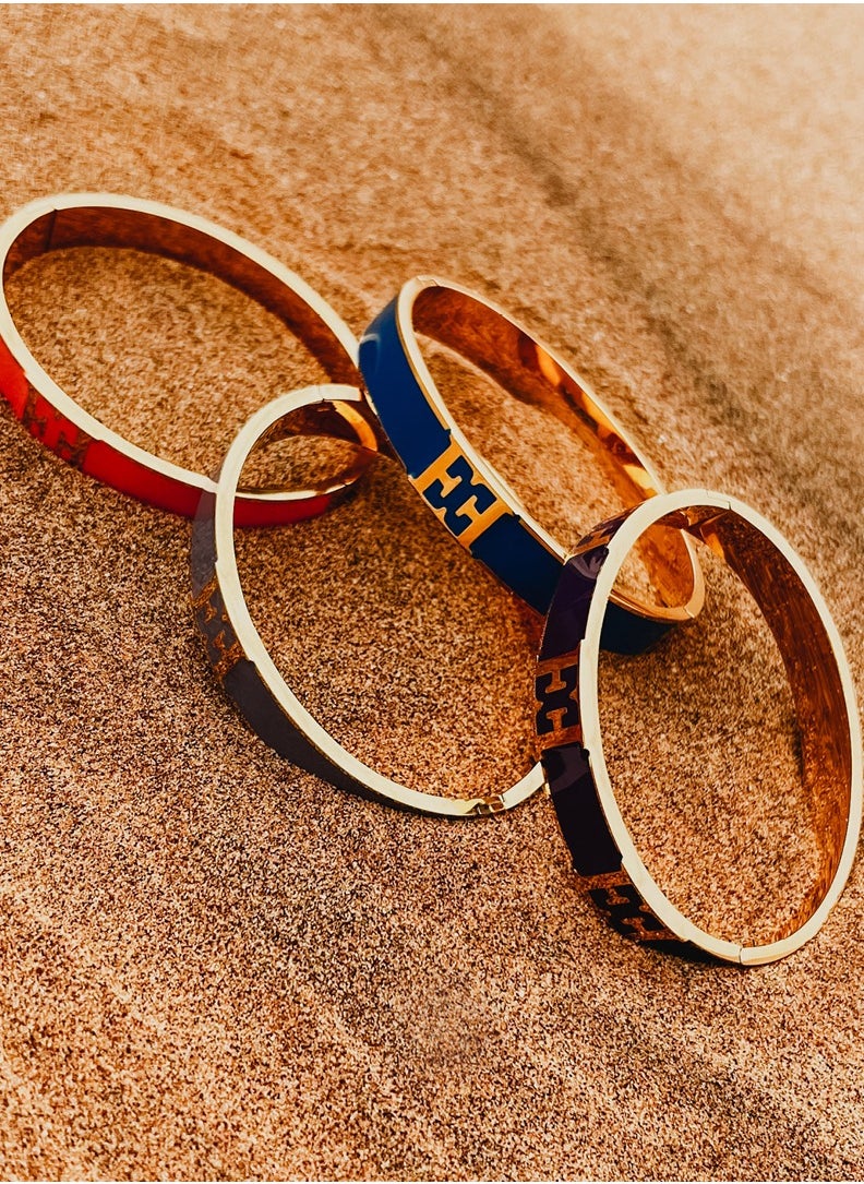 buy-escada-scarlett-gold-plated-bangle-with-logo-cutout-and-black-enamel-detail_bw8