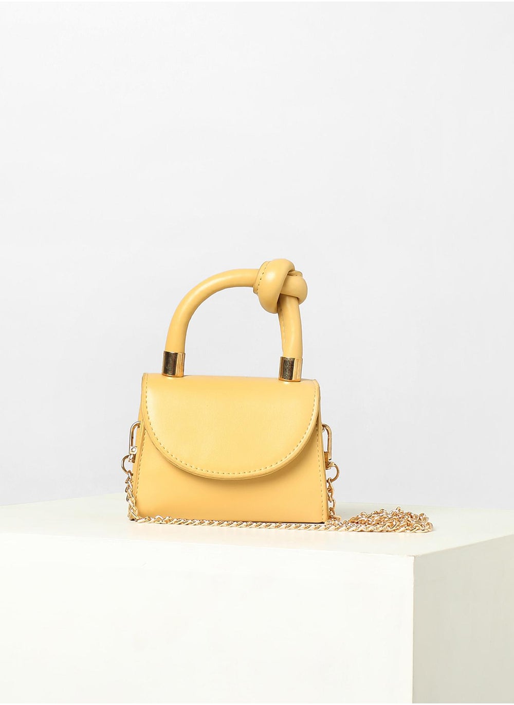 buy-haute-sauce-solid-yellow-handbag-with-a-flap_eof