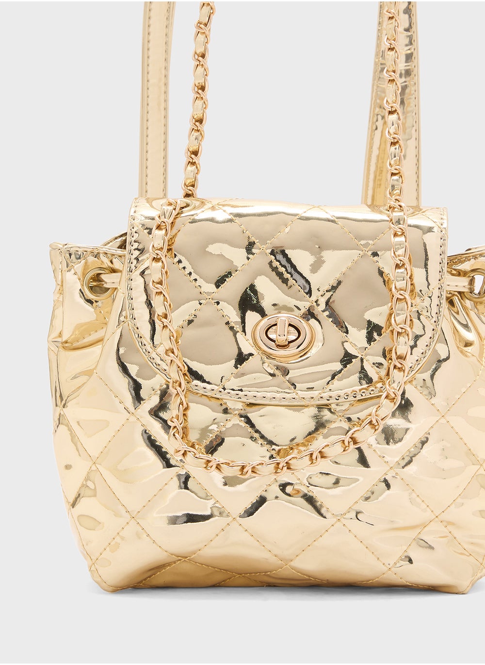 buy-ginger-quilted-metallic-mini-backpack_1xu