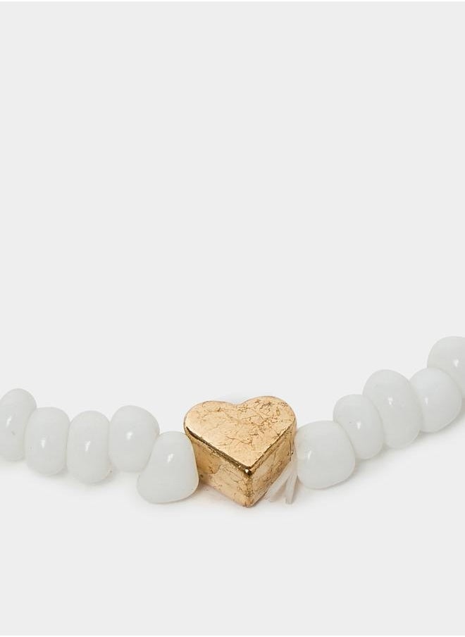 buy-styli-set-of-4-heart-accent-chain-anklets_acv
